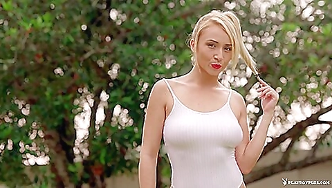 Gorgeous blonde beauty and her body in a sexy outdoor scene