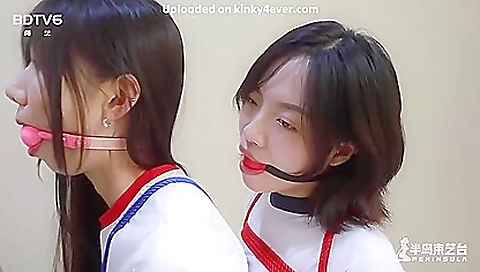 Asian couples with stockings and dresses in threesome