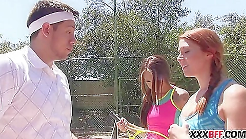 Busty redhead chick and her friend enjoy one another on the beach