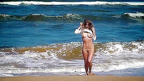 Brunette is playing in the sunshine and getting naked