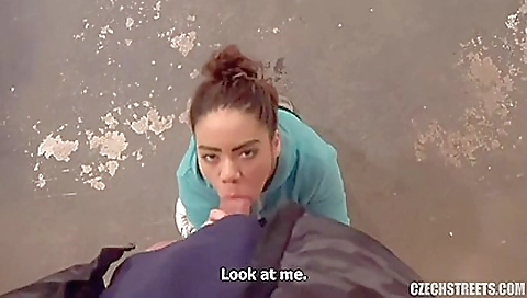 A beautiful black woman with a tattooed body is on top of the bed